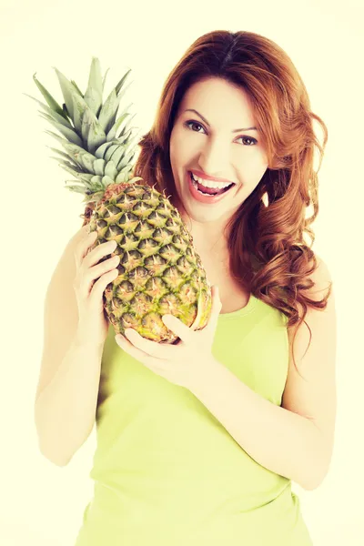 Happy woman with fresh pineapple fruit — Stockfoto