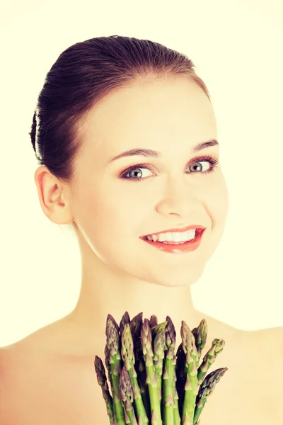 Pretty woman with asparagus — Stock Photo, Image