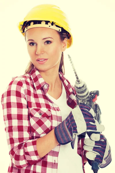 Young woman in protective helmet and jackhammer. — Stock Photo, Image