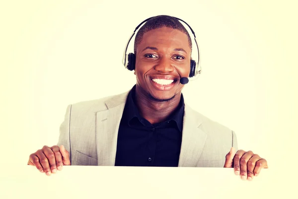Successful call center worker with blank board — Stock Photo, Image