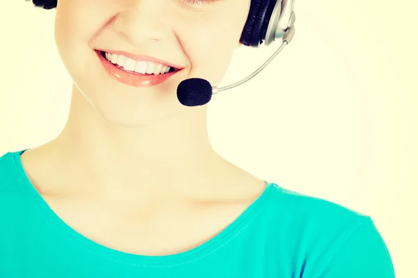 Vackra unga callcenter assistent leende — Stockfoto