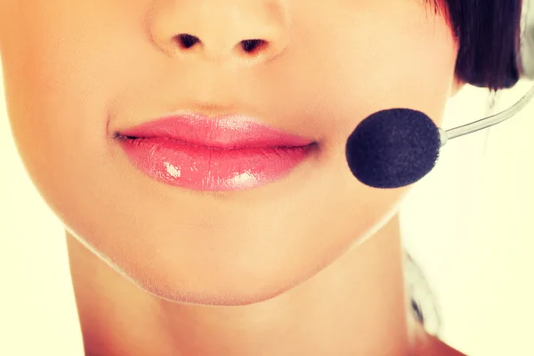 Beautiful young call-center assistant smiling — Stock Photo, Image