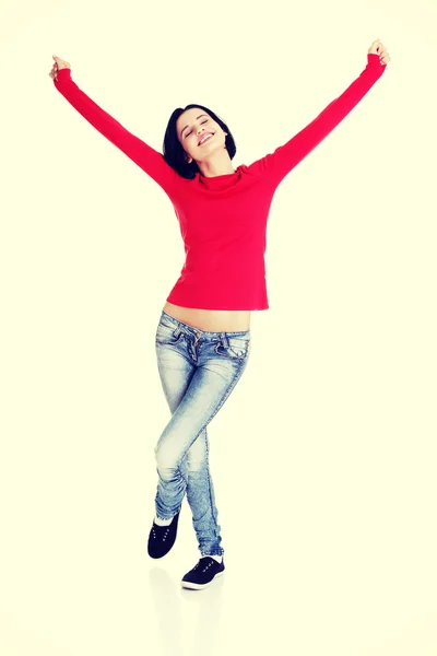 Mujer joven emocionada con los puños en alto — Foto de Stock