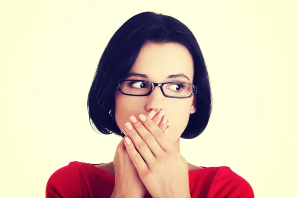 Shocked woman covering her mouth with hands — Stock Photo, Image