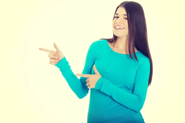 Woman pointing on copy space — Stock Photo, Image