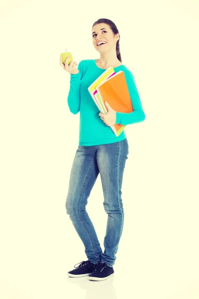 Étudiant avec dossiers et pomme — Photo