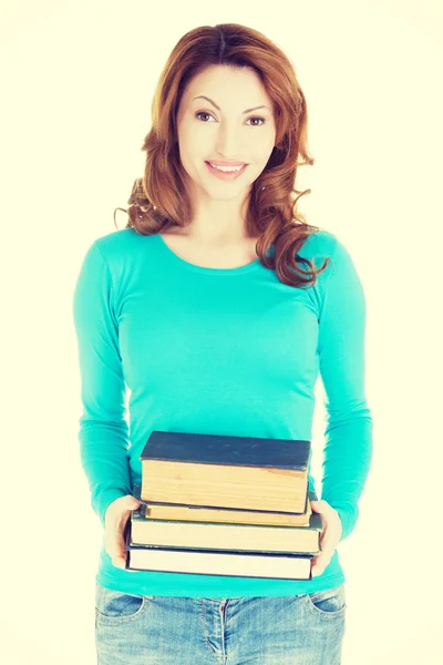 Mulher segurando livros — Fotografia de Stock
