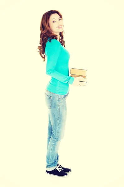 Mulher segurando livros — Fotografia de Stock