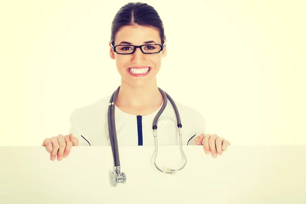 Doctor holding placard — Stock Photo, Image