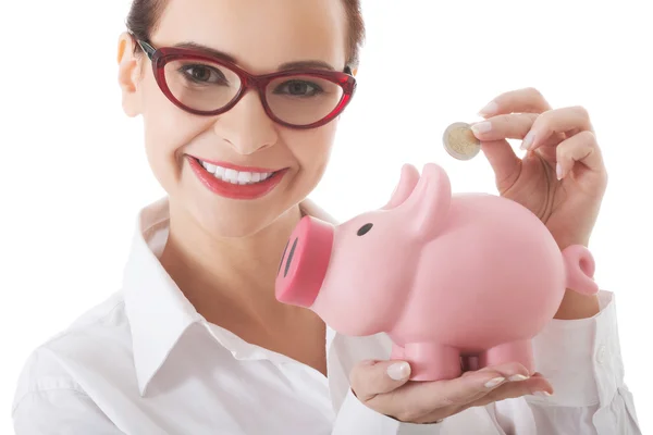 Mujer de negocios con alcancía — Foto de Stock