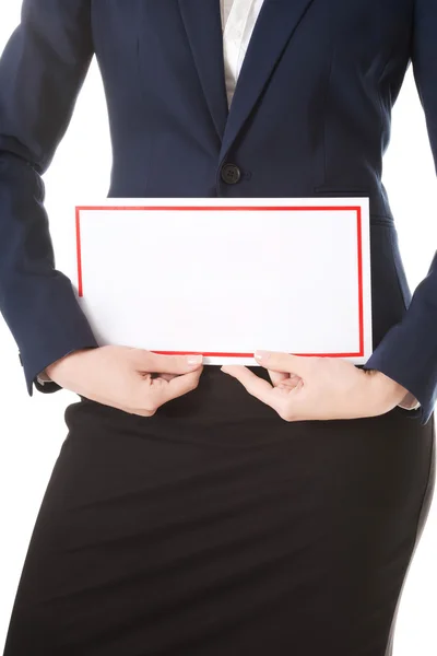 Woman is holding empty board. — Stock Photo, Image