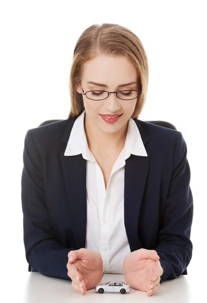 Car toy model between hands — Stock Photo, Image