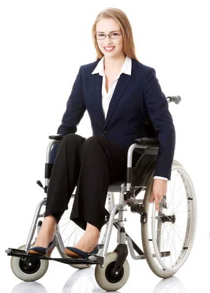 Businesswoman sitting on wheelchair. — Stock Photo, Image