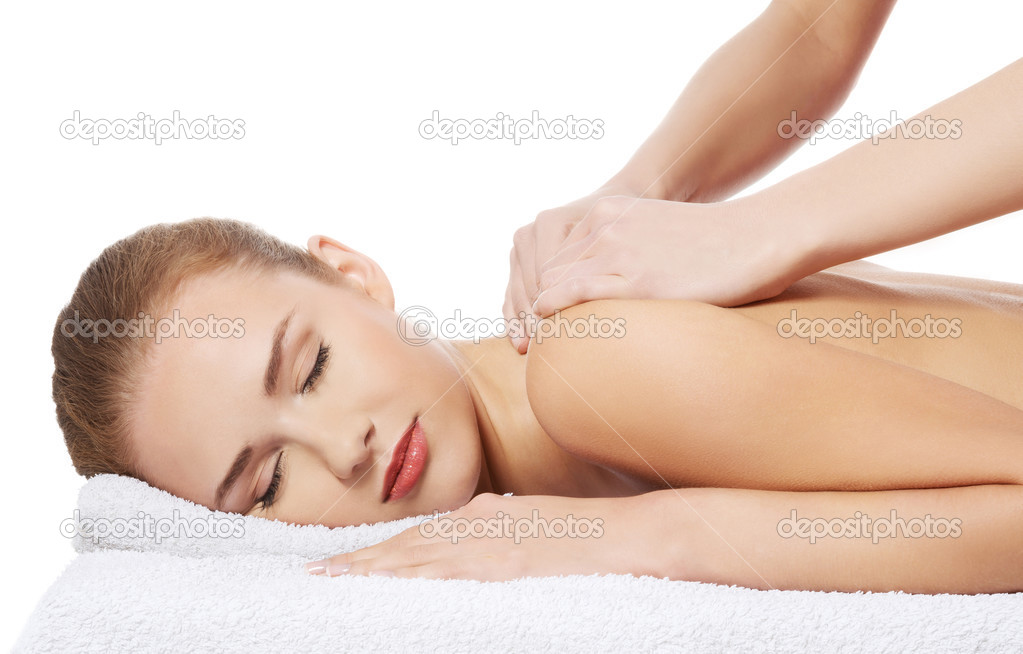 Woman lying and relaxing at spa saloon