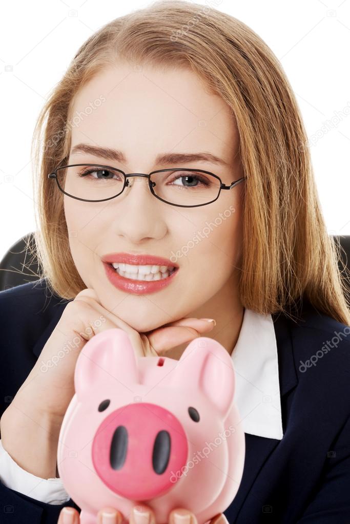 Business woman with piggy bank.
