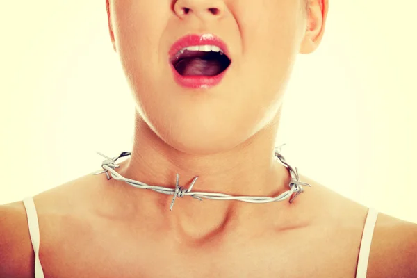 Young woman with barbed wire around her throat. — Stock Photo, Image