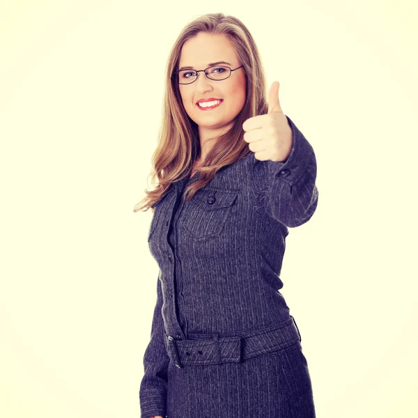 Businesswoman standing with thumb up — Stock Photo, Image