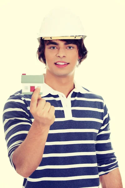 Young man with house model — Stock Photo, Image