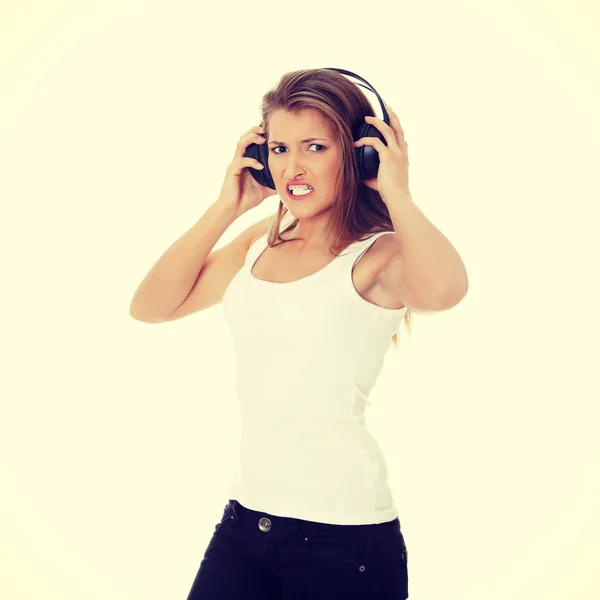 Girl listening aggressive music — Stock Photo, Image