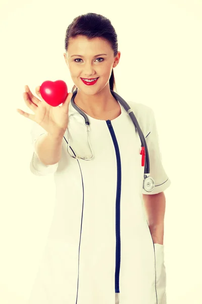 Doctor with heart in hand — Stock Photo, Image