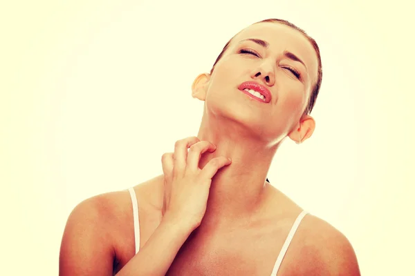 Woman scratching herself — Stock Photo, Image