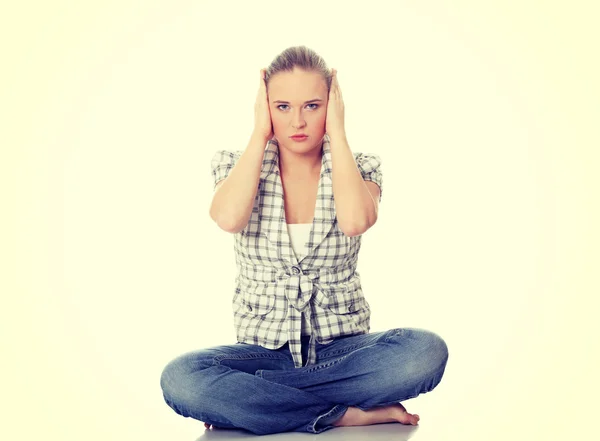 Woman covering ears — Stock Photo, Image