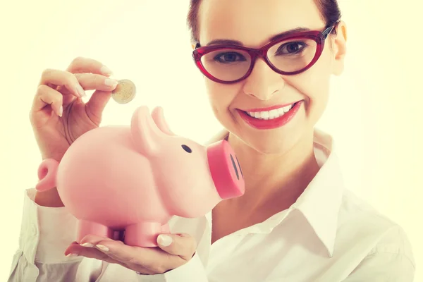 Business woman with piggy-bank — Stock Photo, Image