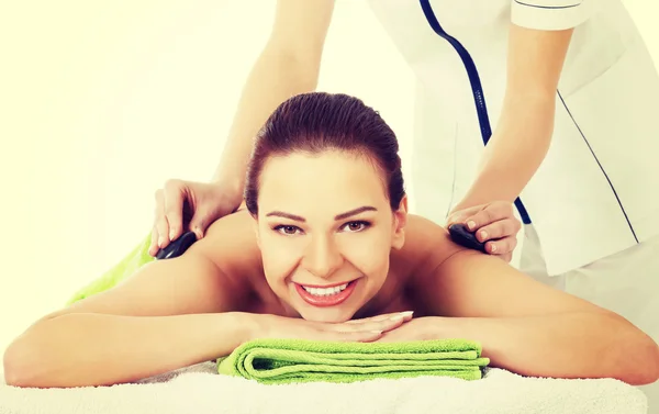 Woman having stone massage. — Stock Photo, Image