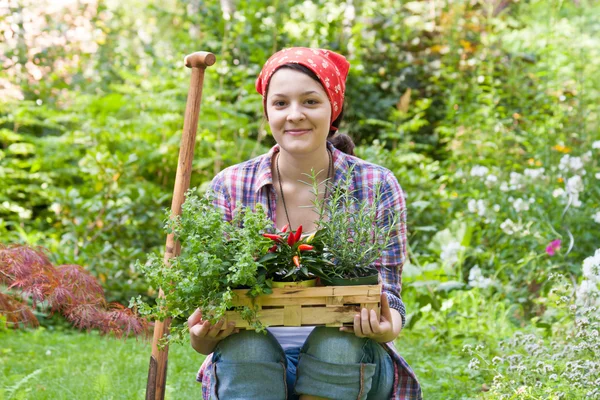 Young woman in a garden — Stock Photo, Image