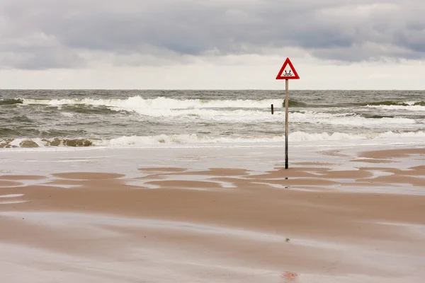 Danger label at the North Sea — Stock Photo, Image