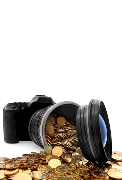 Slr camera with lens full of golden coins — Stock Photo, Image