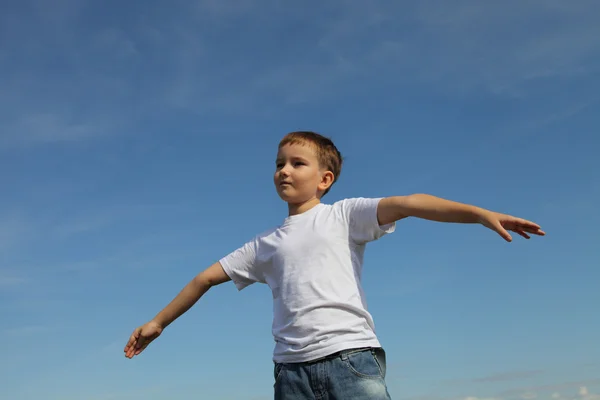 Boy stands in the sky — Stock Photo, Image