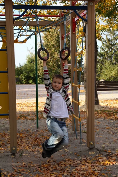 Boy playing on the playground — Stock Photo, Image