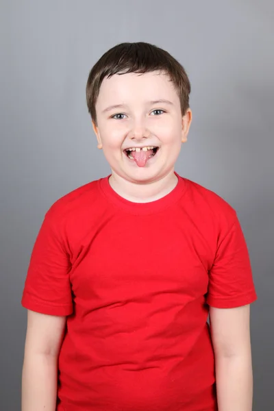 Boy showing tongue — Stock Photo, Image