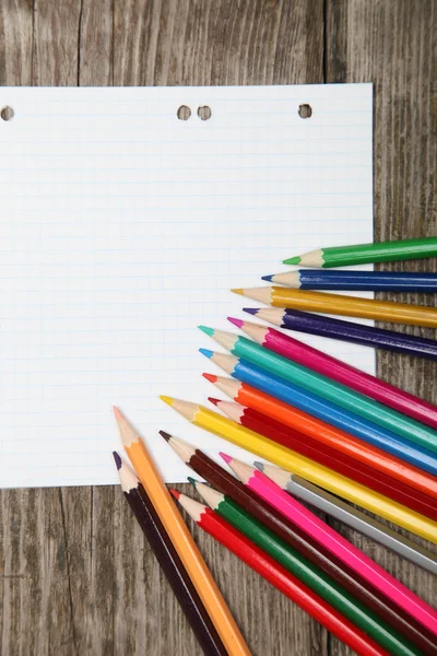 Checkered sheet and pencils — Stock Photo, Image