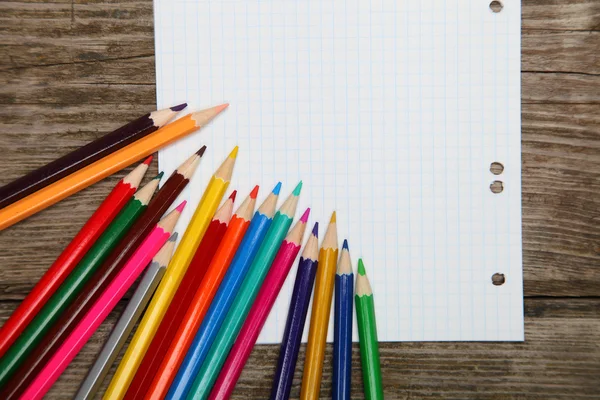 Checkered sheet and pencils — Stock Photo, Image