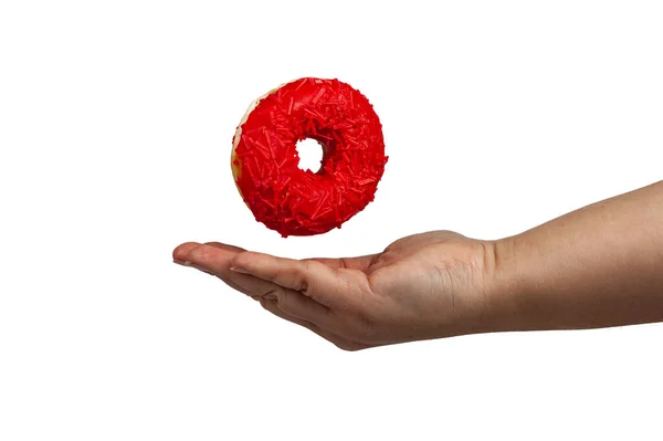 Vrouwelijke Hand Vangt Een Donut Geïsoleerd Een Witte Achtergrond — Stockfoto