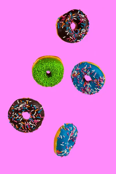 Flying Multicolored Donuts Pink Background Levitation — 图库照片