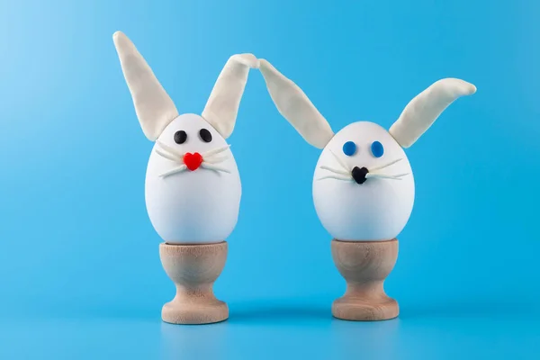 Easter Eggs Form Rabbit Wooden Stands Blue Background Place Your — Stock Photo, Image