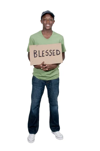 Człowiek posiadający znak, że mówi błogosławiony — Zdjęcie stockowe