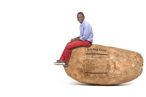 Boy Sitting on Potato — Stock Photo, Image