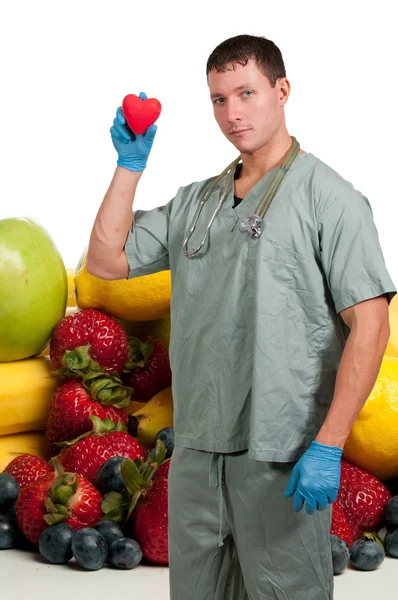 Médico con frutas surtidas —  Fotos de Stock