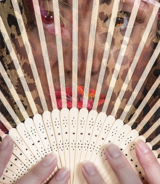 Woman with an Asian fan — Stock Photo, Image
