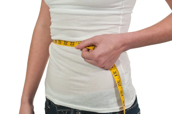 Mujer midiendo su cintura — Foto de Stock