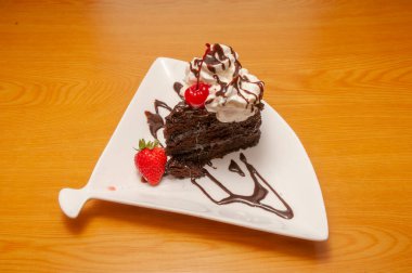 Piece of decadently delicious traditional chocolate cake.