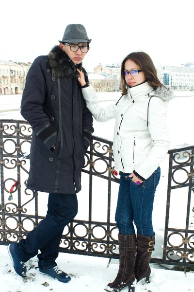 Happy Young Couple standing on the bridge — Stock Photo, Image