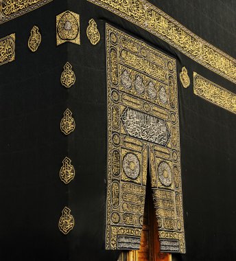 Makkah Kaaba Door with verses from the Qoran holy book in gold clipart
