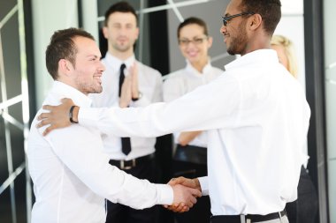 Business handshake after signing new contract clipart