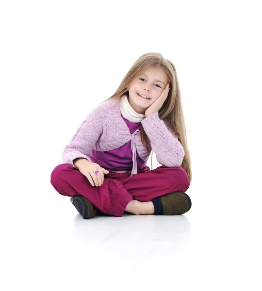 Portrait of a cute little girl sitting on floor — Stock Photo, Image