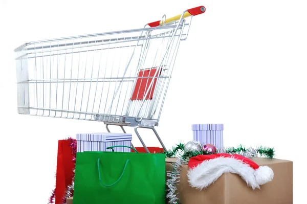 Carrinho de compras com caixas e sacos, boas festas — Fotografia de Stock